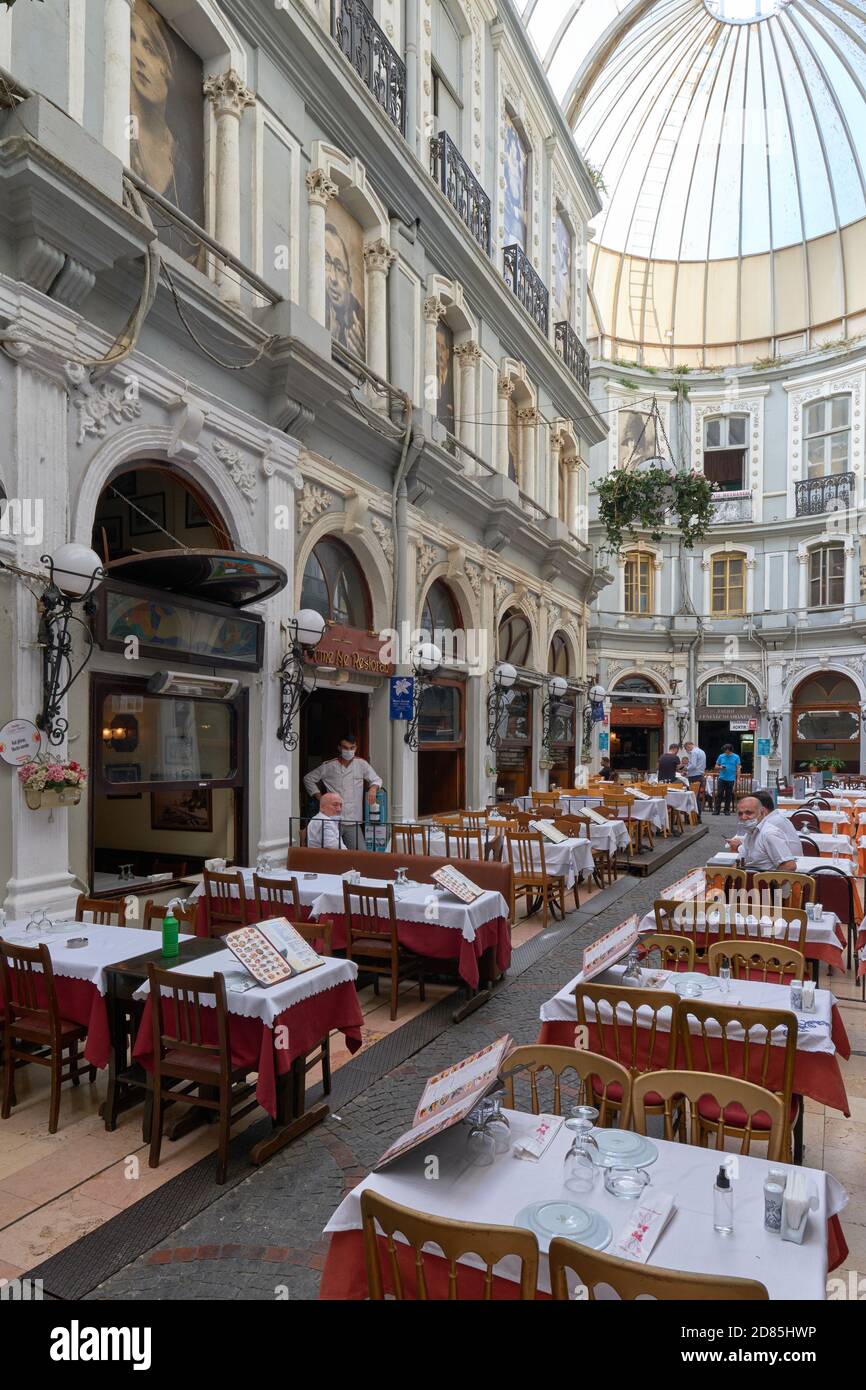 Tables of restaurants in famous Cicek Pasaji, Istiklal street, Istanbul, Turkey Stock Photo