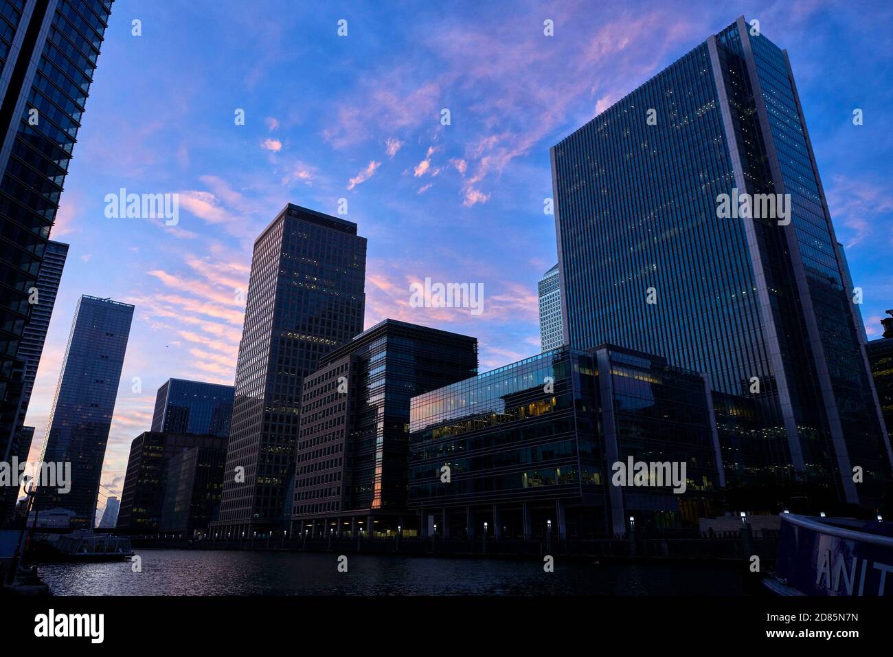 Office buildings and residential towers at dusk, Canary Wharf, Docklands, East end of London, UK Stock Photo