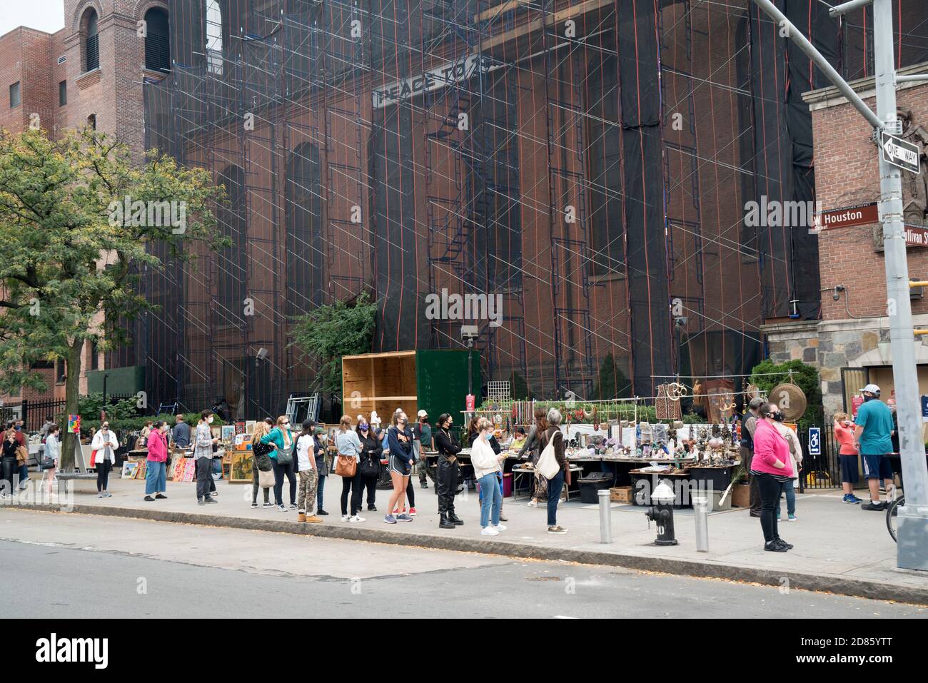 Thousands of people waited at the St. Anthony of Padua Church in Soho, Manhattan on the first day of early presidential voting in New York State. Stock Photo