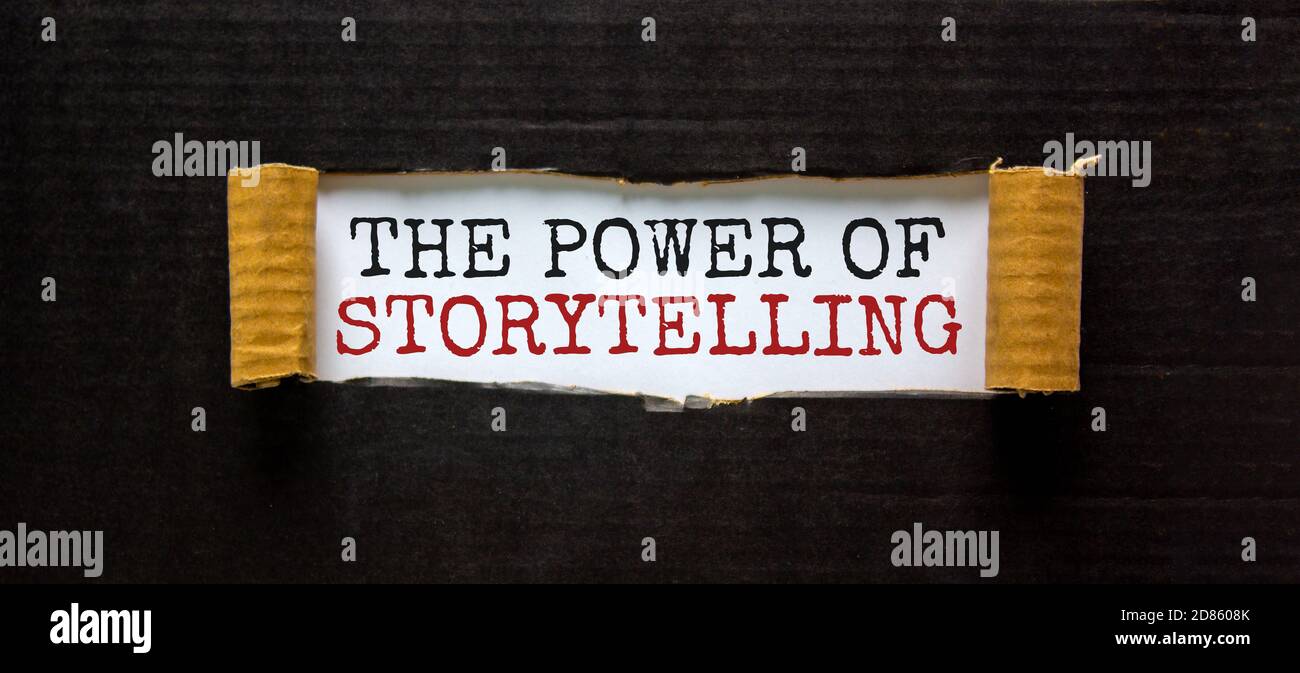 The Words the Power Of Storytelling Appearing Behind Torn Black Paper 
