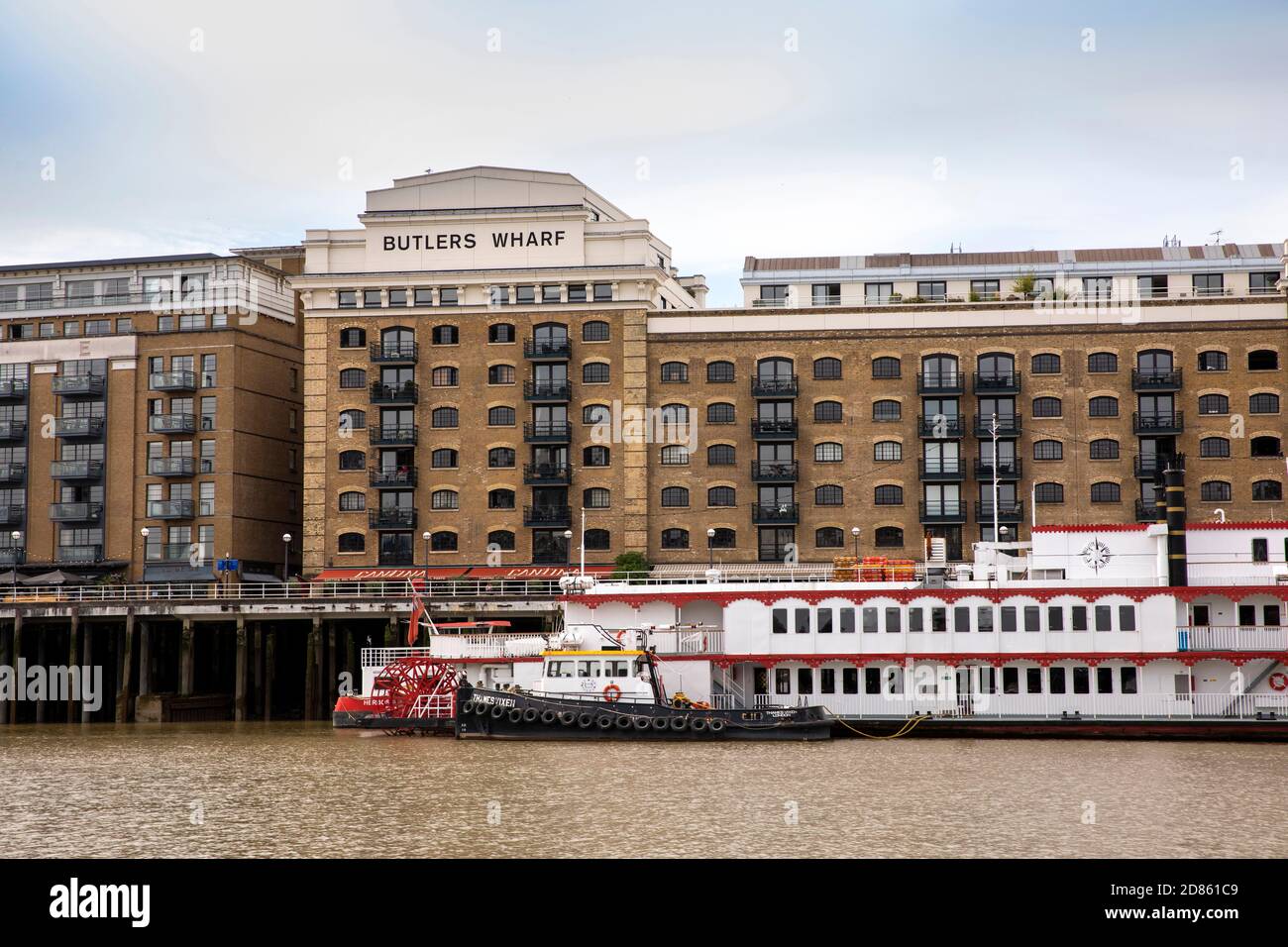 UK, London, Butlers Wharf riverside warehouse converted to upmarket housing beside River Thames Stock Photo