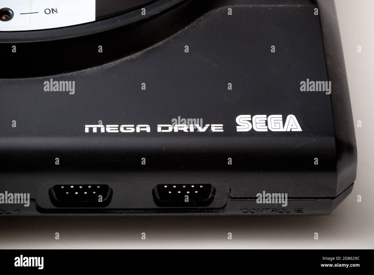 London, United Kingdom, 21st September 2020:- A retro Sega Mega Drive 16-bit gaming console isolated on a white background Stock Photo