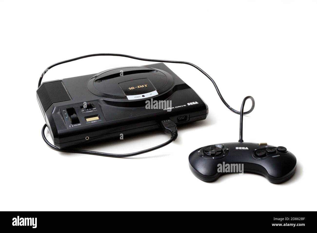 London, United Kingdom, 21st September 2020:- A retro Sega Mega Drive 16-bit gaming console and controller isolated on a white background Stock Photo