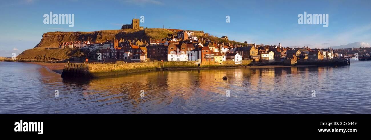 Vibrant late afternoon/early evening panorama of Whitby Harbour and St Mary's Church, North Yorkshire, UK Stock Photo