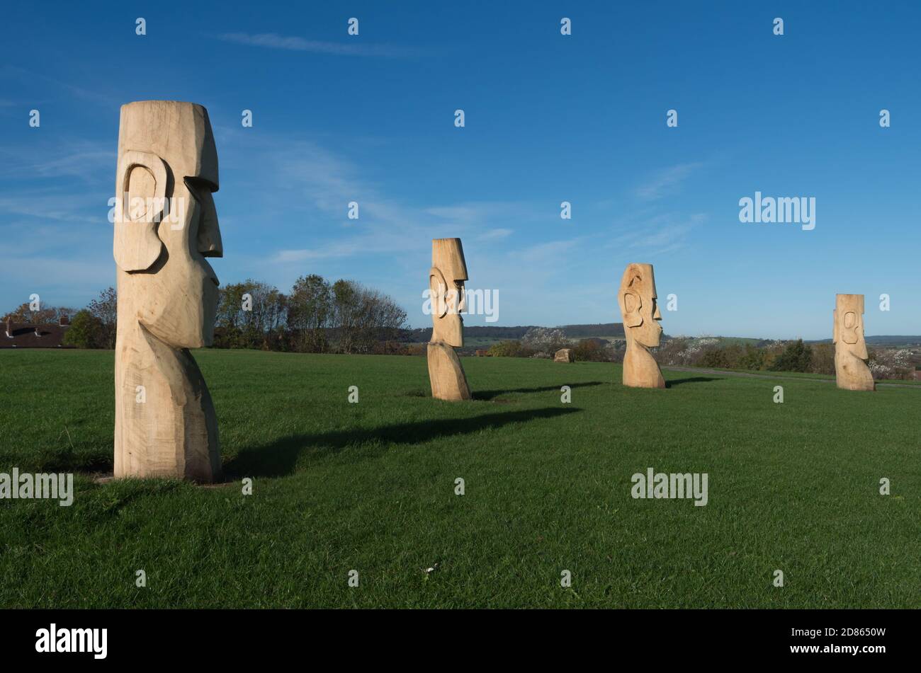 Ring of replica Easter Island carved wooden heads at Jonnos Field, seaside town of Scarbourough, North Yorkshire, UK Stock Photo