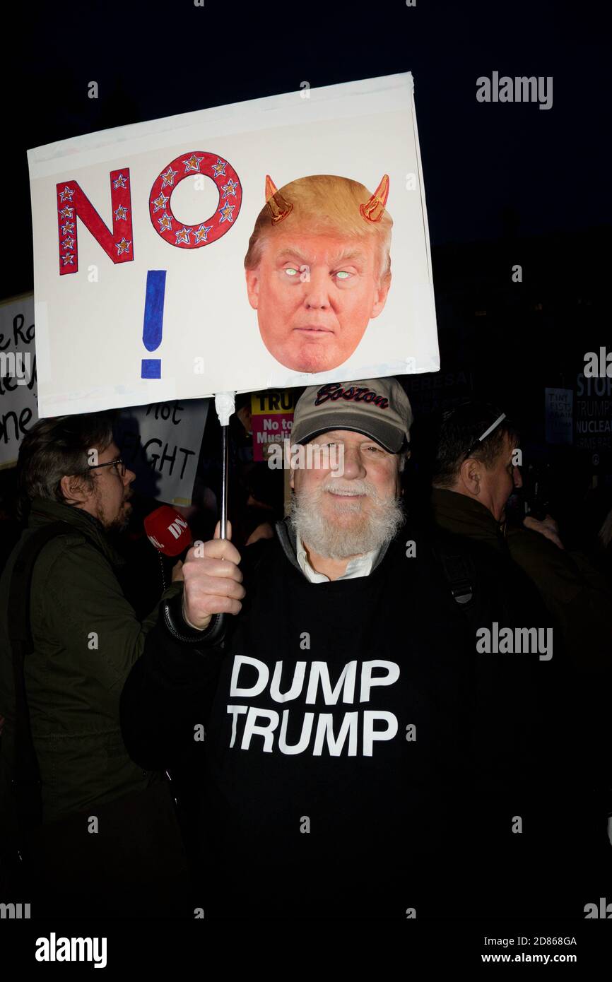 Londonl, United Kingdon - Febuary 20th, 2017: Protesters gather in Parliment Square to protest the invitation to United States President Donald Trump Stock Photo