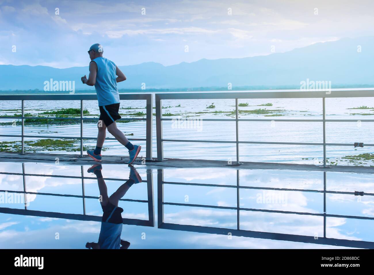 Asian man running hi-res stock photography and images - Alamy