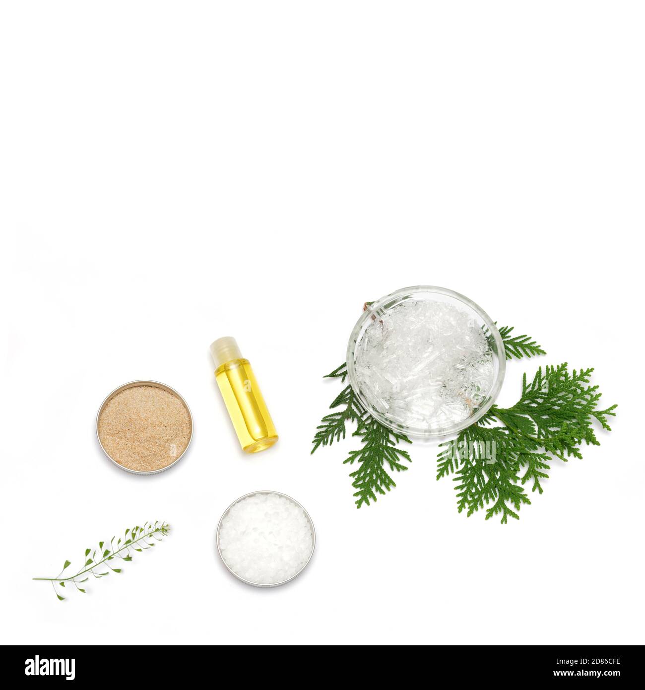 Ingredients for the production of cosmetics on a white background. Herbal powders, dried flowers, menthol crystals, oil. Natural cosmetics concept. Stock Photo