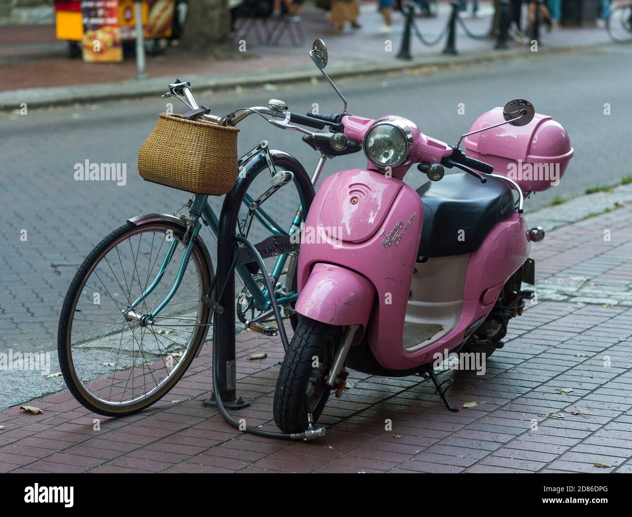 Moped and bicycle parked at roadside, Gastown, Vancouver, Lower Mainland, British Columbia
