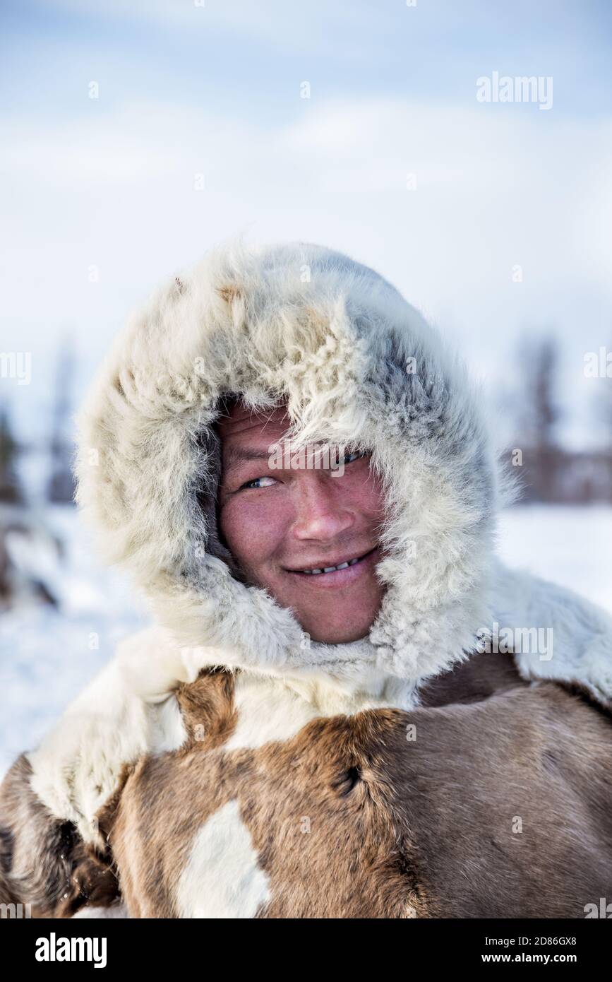 Portrait of a Nenet man with traditional reindeer fur wear, Yamalo-Nenets Autonomous Okrug, Russia Stock Photo