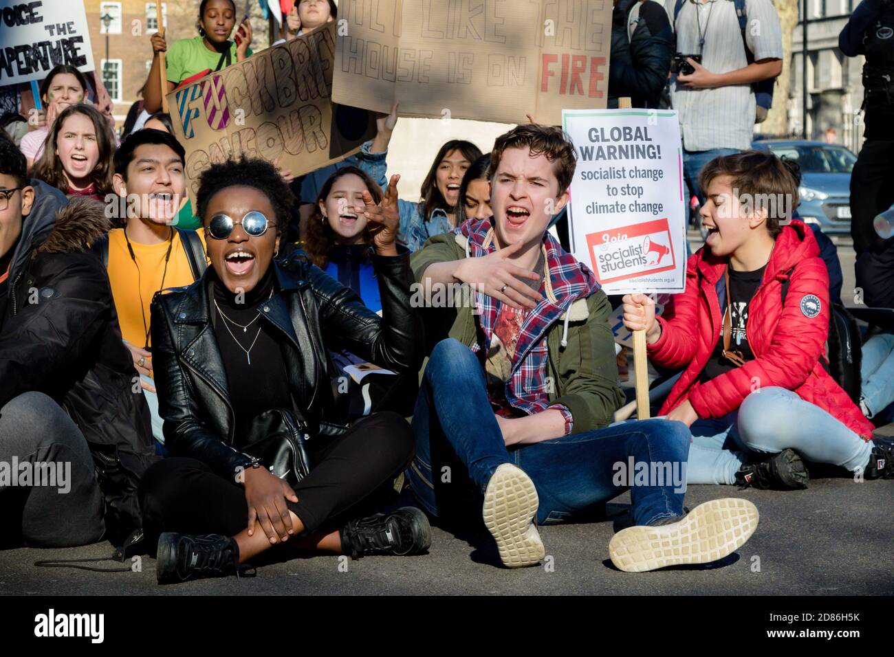 London, UK, United Kingdom 15th February 2019:- Striking school aged children in central London over climate change stage a sit down protest blocking Stock Photo