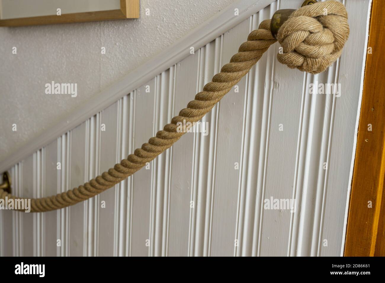 Beautiful interior view of nautical rope handrails on white wall  background. Interior details decoration concept Stock Photo - Alamy