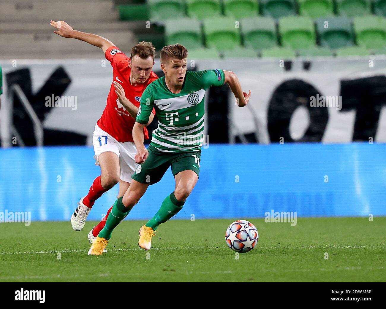 Lyes Houri of MOL Fehervar FC challenges David Siger of