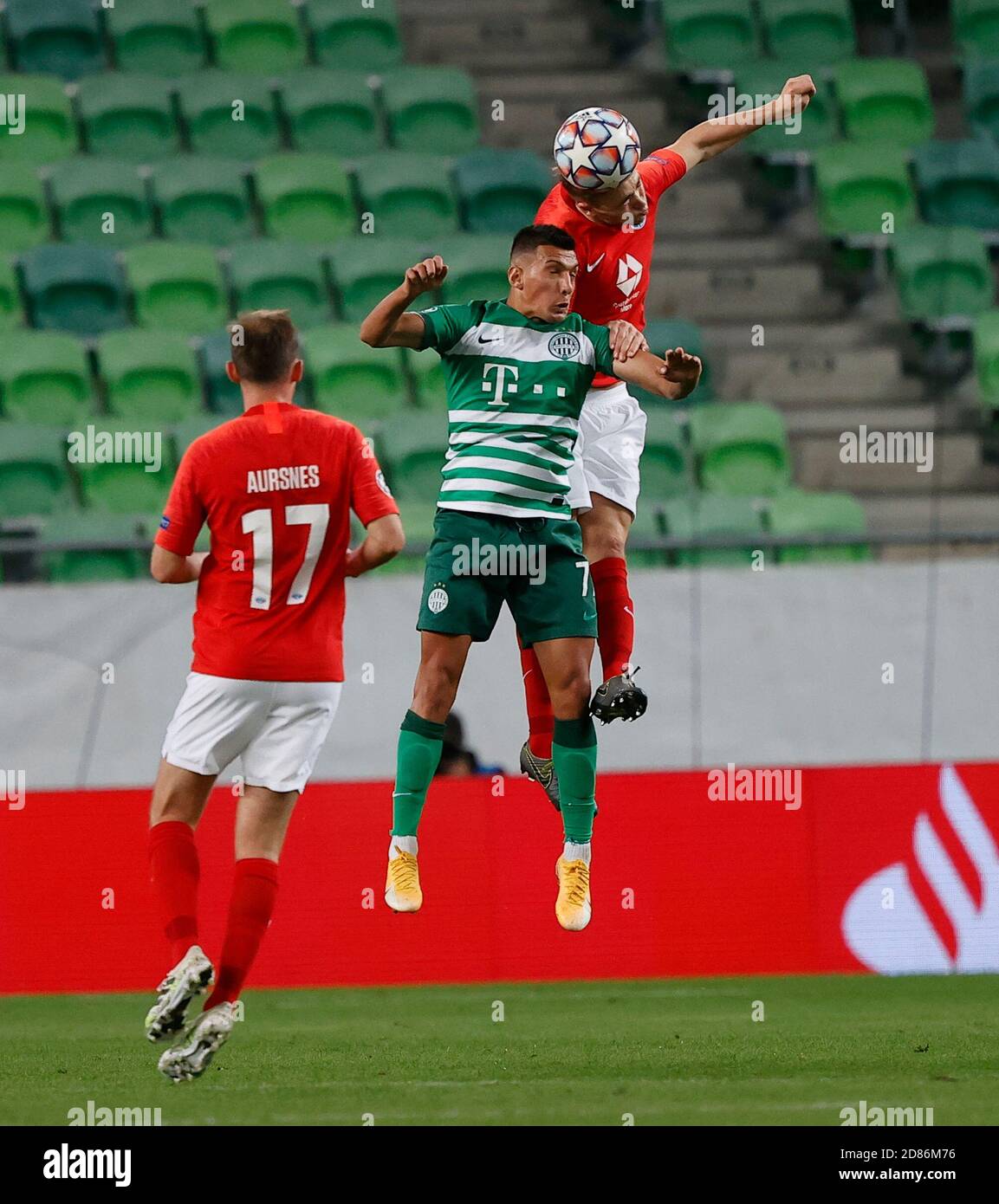 BUDAPEST, HUNGARY - SEPTEMBER 29: (l-r) Oleksandr Zubkov of Ferencvarosi TC  and Somalia of Ferencvarosi TC fights for the ball with Martin Ellingsen of  Molde FK during the UEFA Champions League Play-Offs