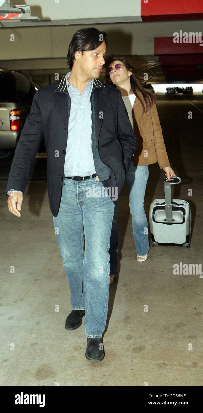 Elizabeth Hurley and boyfriend  Arun Nayar arrive at Miami International Airport, 4/25/05 [[cad]] Stock Photo