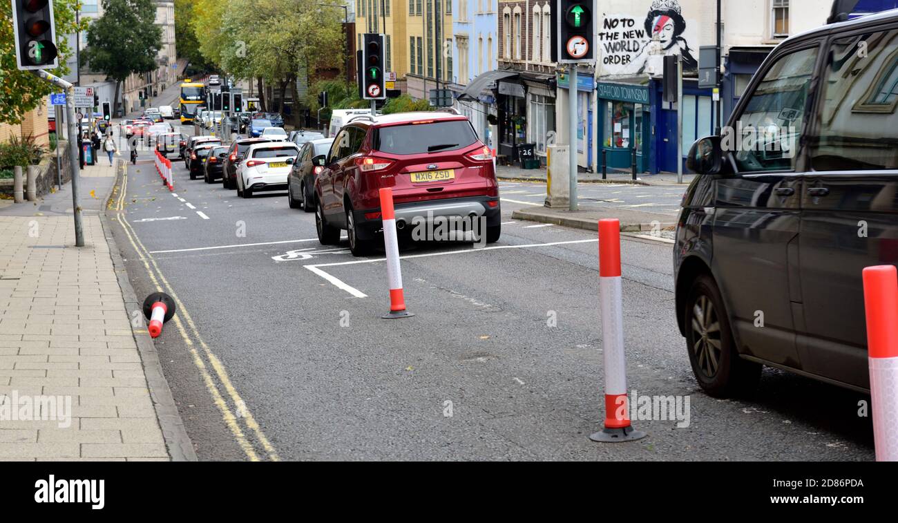 Pop up cycle lanes created to encourage bicycle travel due to covid, but causing traffic congestion, more pollution Bristol Upper Maudlin St, UK Stock Photo