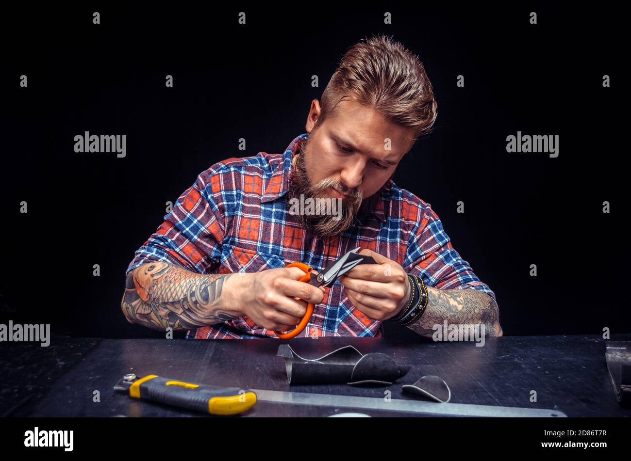 Tanner creating a new leather product Stock Photo