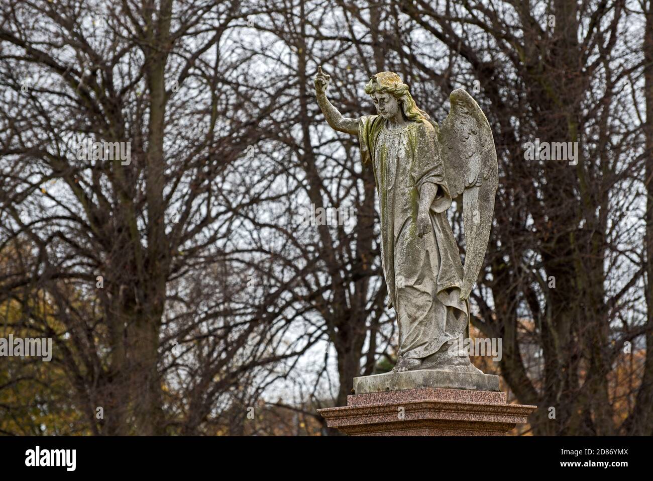 Statue of an angel pointing to the heavens in Morningside Cemetery Edinburgh, Scotland, UK. Stock Photo