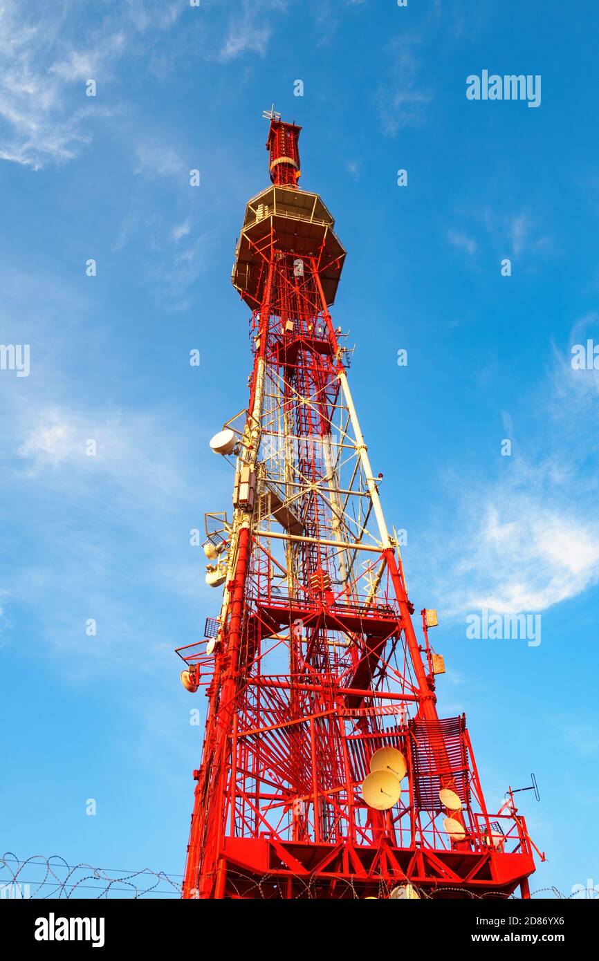 Bottom view of Pyatigorsk TV tower on background of blue sky with clouds in sunny day. Stock Photo