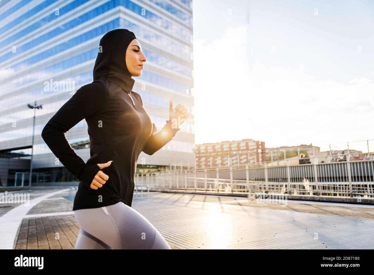 Muslim sportive girl with fit body training outside - Beautiful woman ...