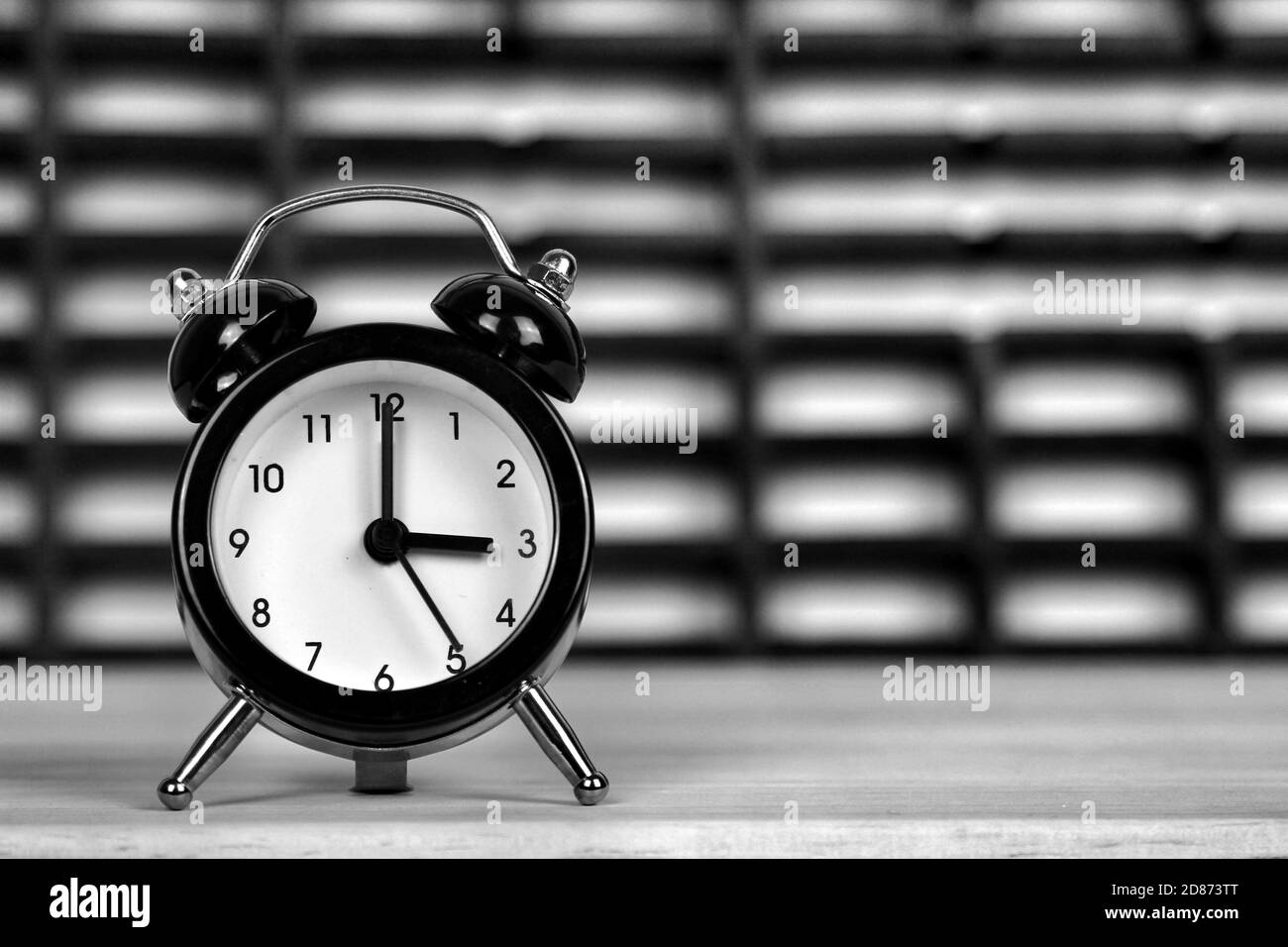 Clock marking winter time change over checkered background Stock Photo Alamy