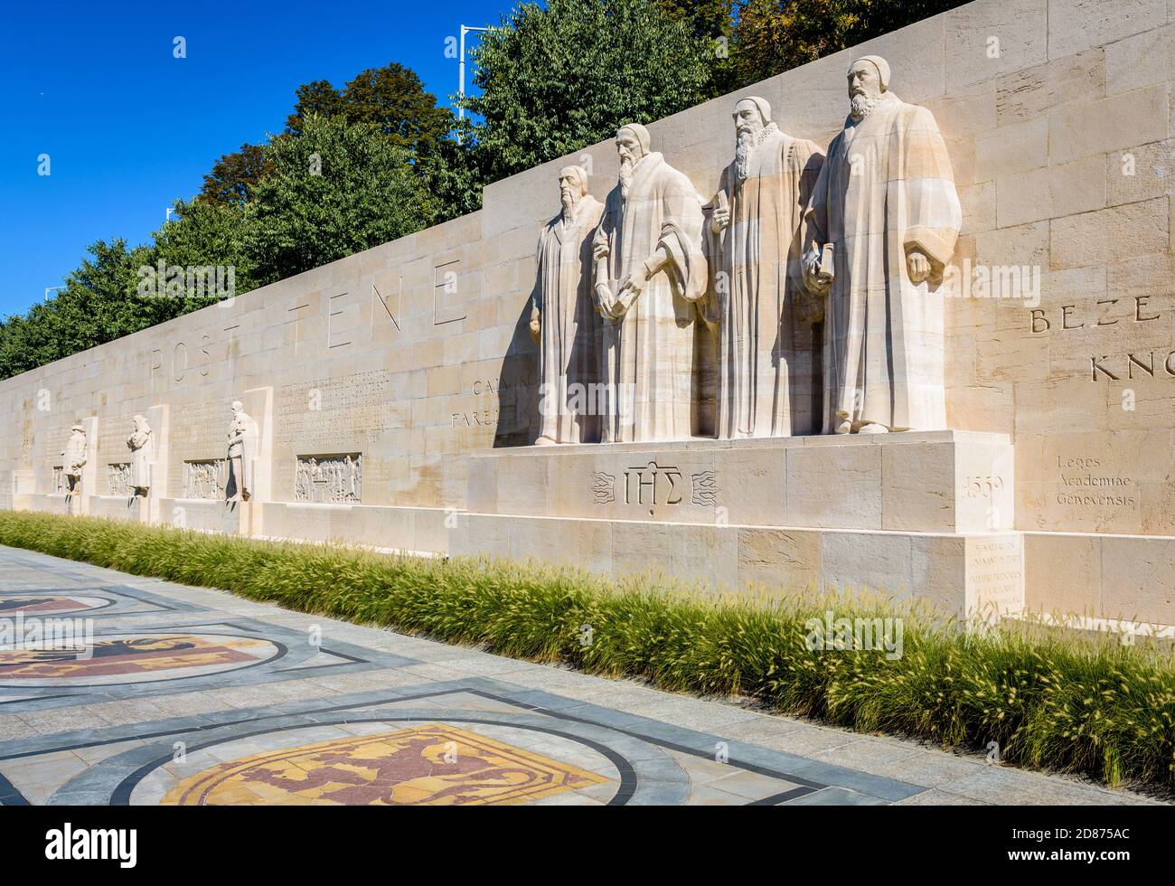 General view of the left half of the Reformation Wall in Geneva, Switzerland, with the statues to John Calvin and the Calvinism's main proponents. Stock Photo
