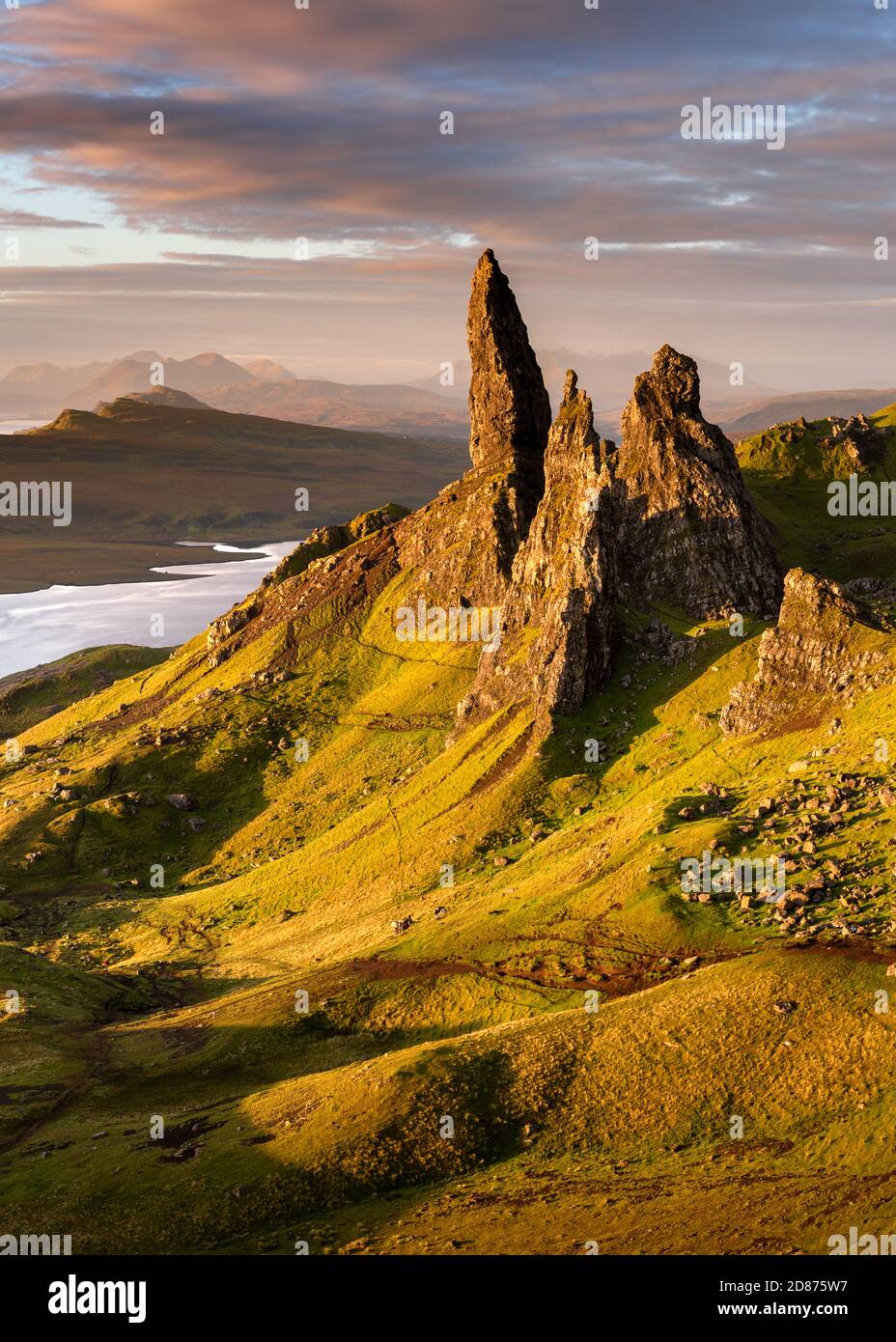 The Old Man of Storr rock pinnacles at sunrise with vibrant Summer ...