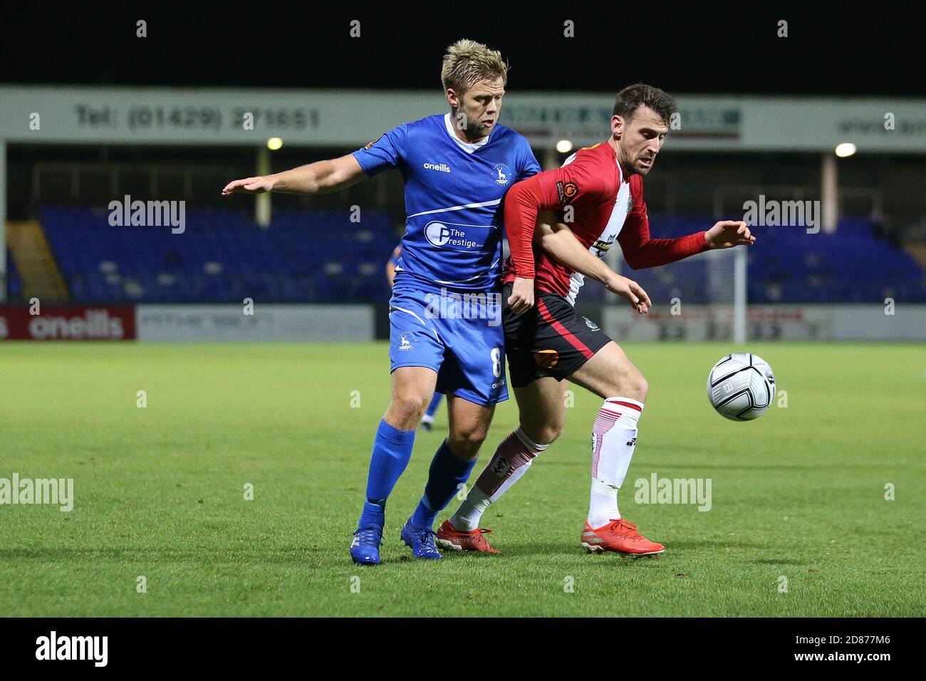 Hartepool, County Durham, UK. 27th Oct 2020. Lewis Cass of Hartlepool United  in action with Altrincham's Yusifu Ceesay during the Vanarama National  League match between Hartlepool United and Altrincham at Victoria Park