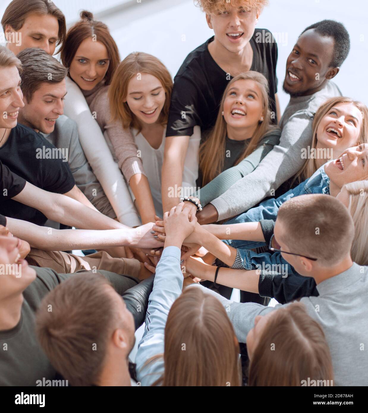 group of diverse people joining their hands in a circle Stock Photo - Alamy