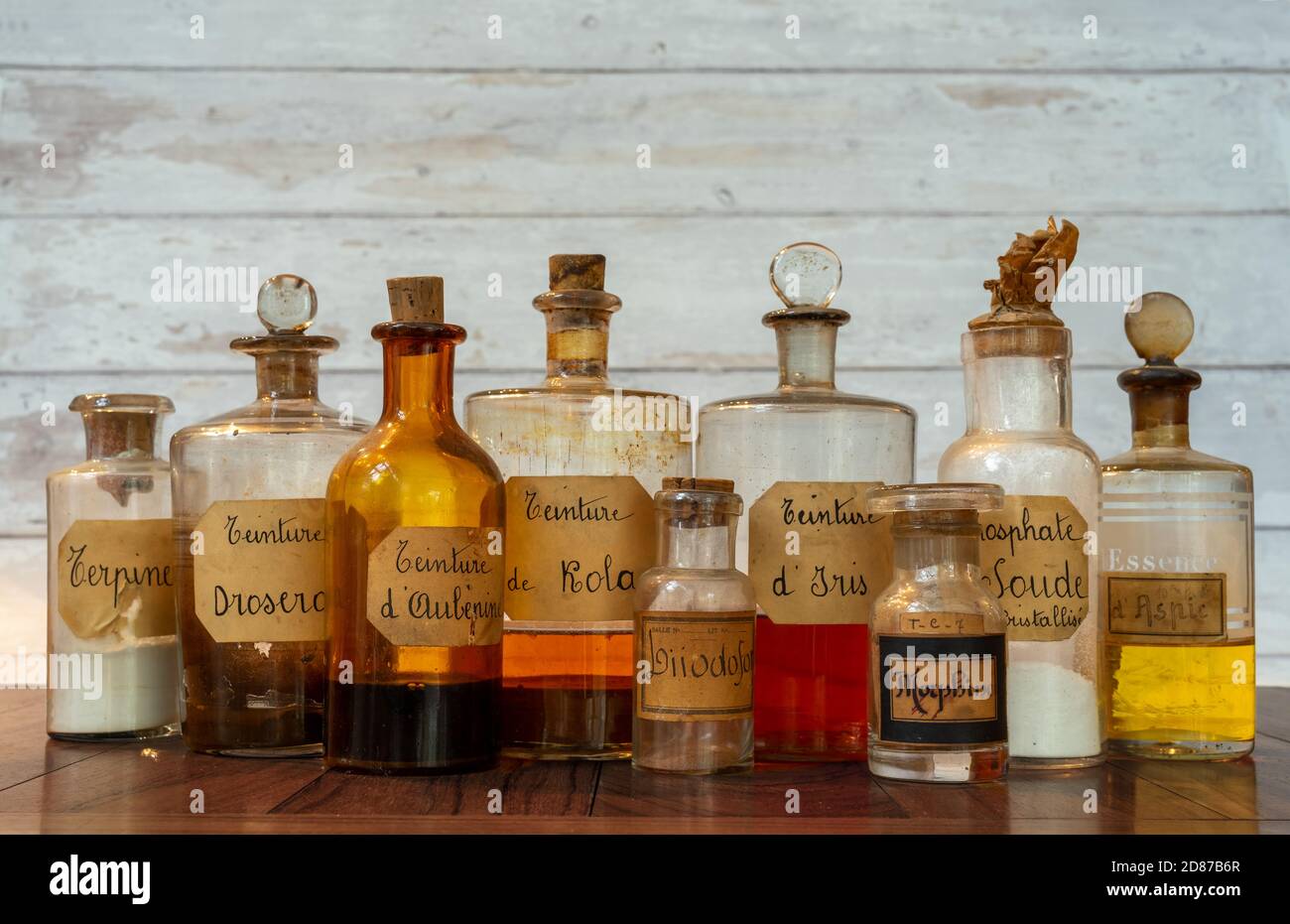 ancient apothecary pots with ingredients for medicine isolated over