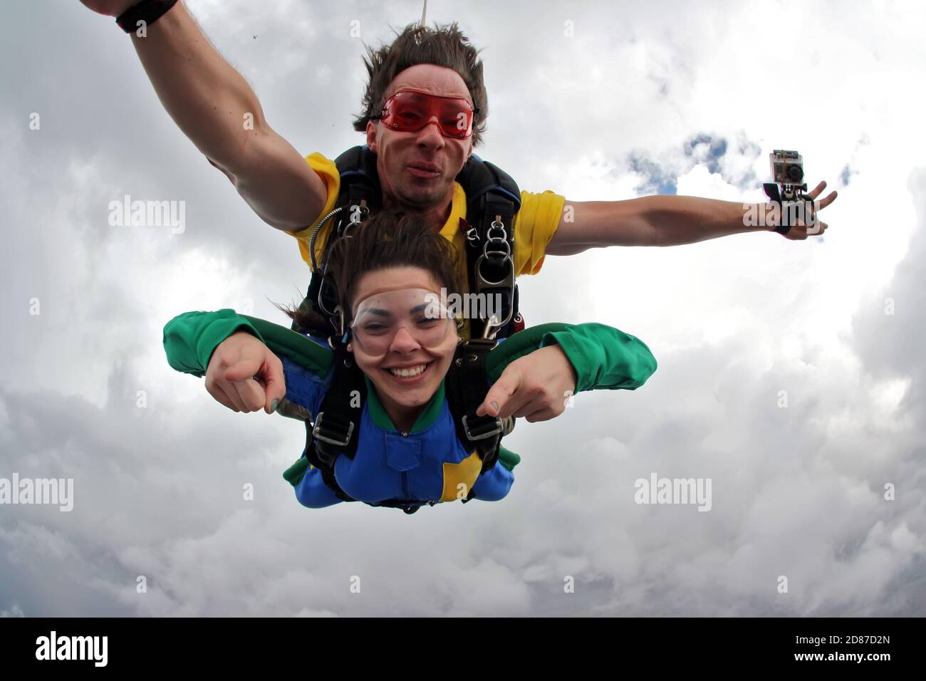 Skydiving tandem happiness on a cloudy day Stock Photo