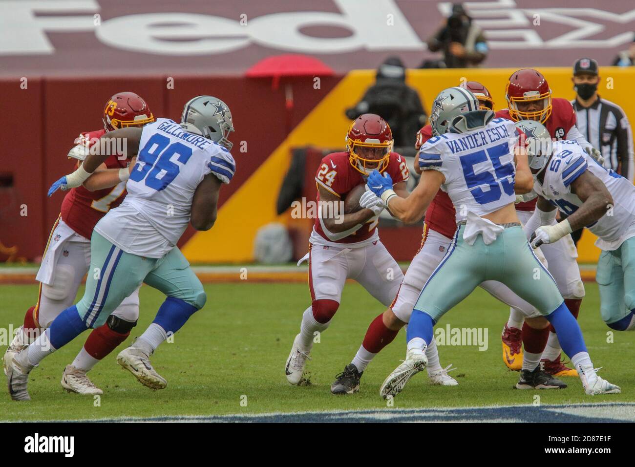 Cincinnati, OH, USA. 13th Dec, 2020. Dallas Cowboys defensive tackle  Neville Gallimore #96 breaks through between Cincinnati Bengals offensive  guard Quinton Spain #67 and Cincinnati Bengals offensive tackle Bobby Hart  #68 during