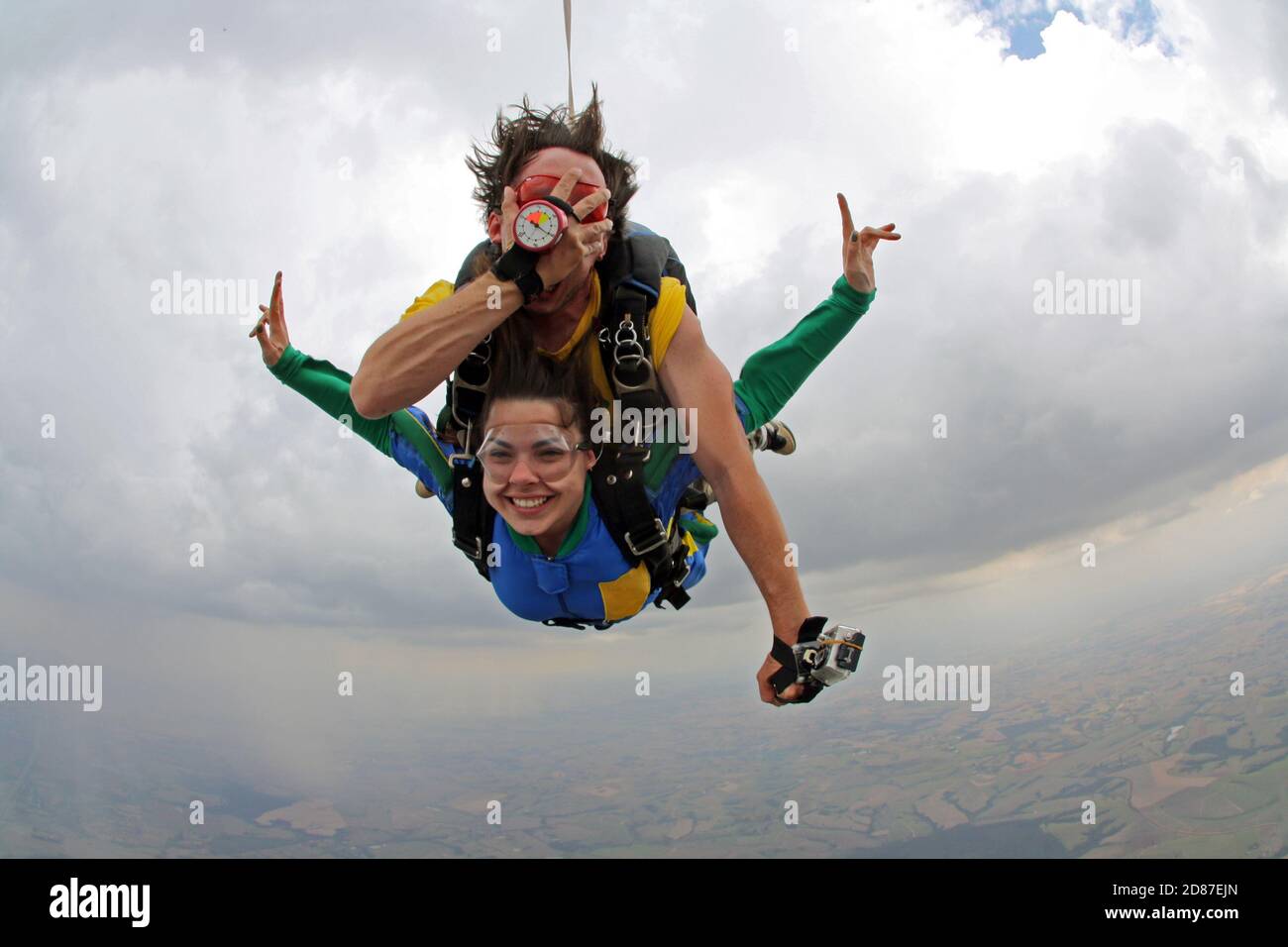 Skydiving tandem happiness on a cloudy day Stock Photo