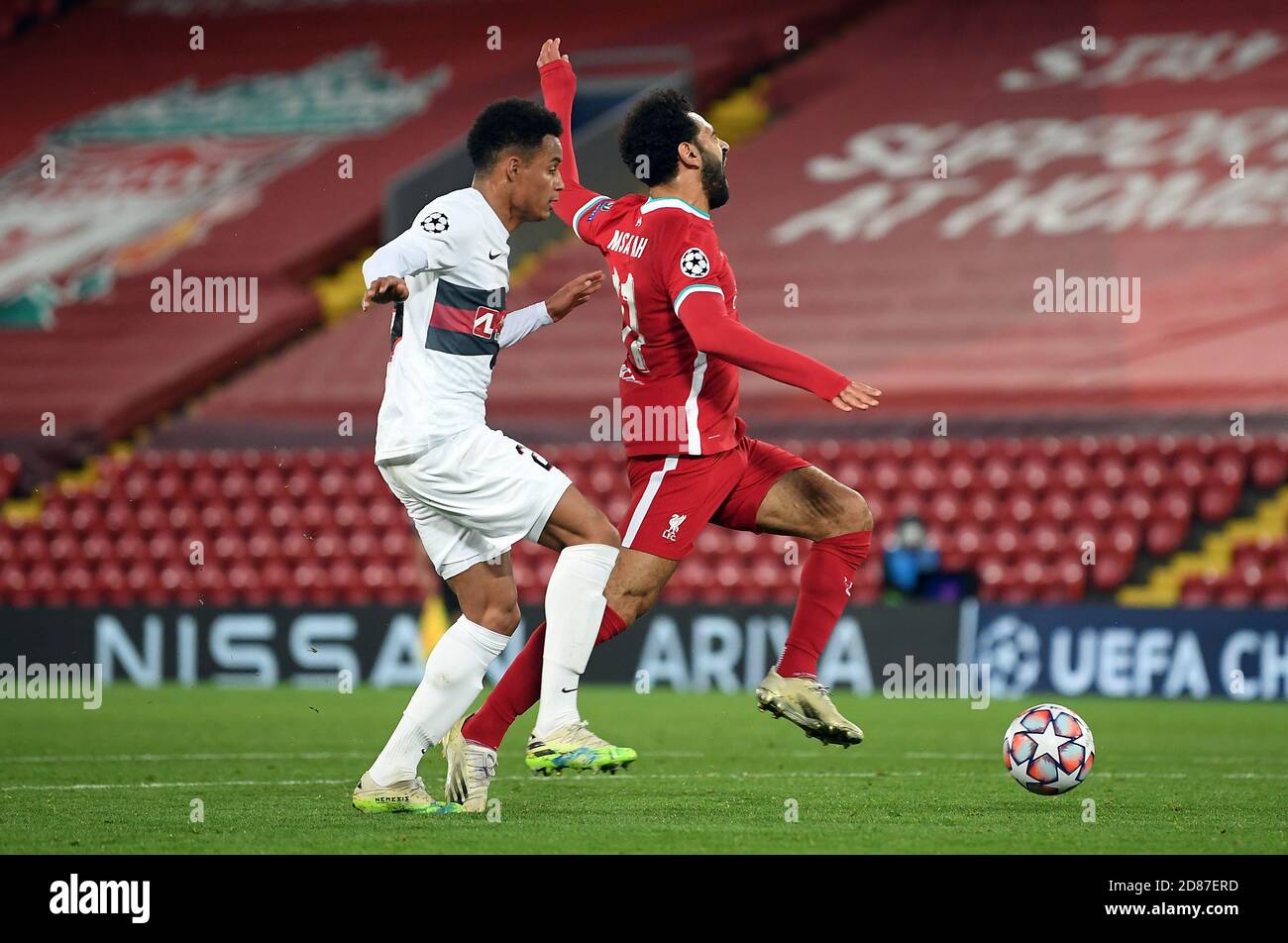 FC Midtjylland's Paulinho concedes a penalty for a foul on Liverpool's  Mohamed Salah during the UEFA Champions League Group D match at Anfield,  Liverpool Stock Photo - Alamy