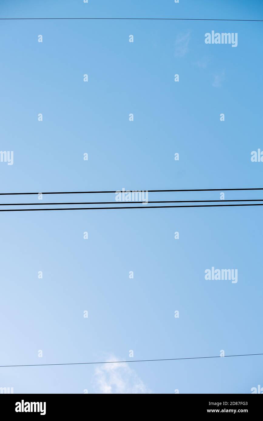 Electric transformer power lines blue sky background Stock Photo - Alamy