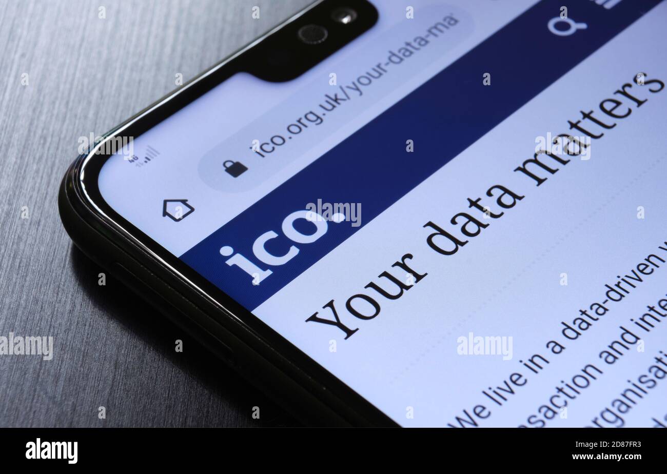 The Information Commissioner's Office ICO website seen on the smartphone corner. The United kingdom watc Stock Photo