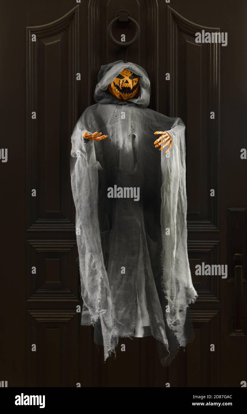 Pumpkin Ghost Hanging on a Door Halloween Home Decor Stock Photo