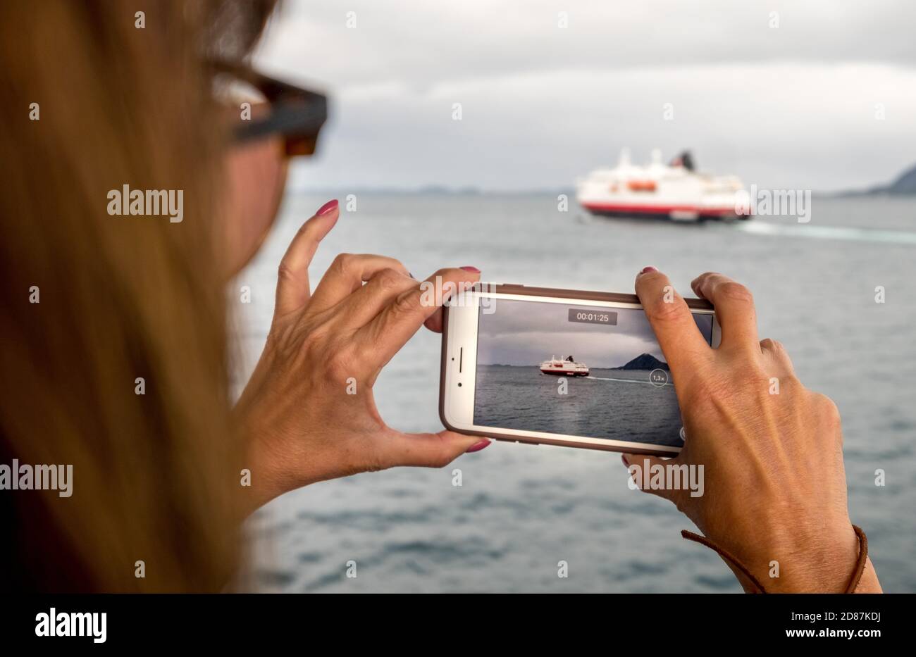 Ship MS Kong Harald, mobile phone photography, ship filming, Bolga, Nordland, Norway, Scandinavia, Europe, adventure travel, tourism, Hurtigruten, Hur Stock Photo