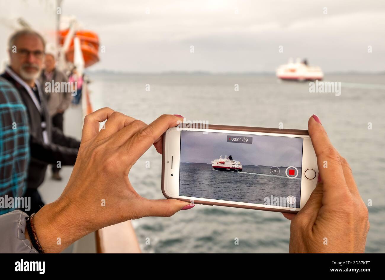 Ship MS Kong Harald, mobile phone photography, ship filming, Bolga, Nordland, Norway, Scandinavia, Europe, adventure travel, tourism, Hurtigruten, Hur Stock Photo