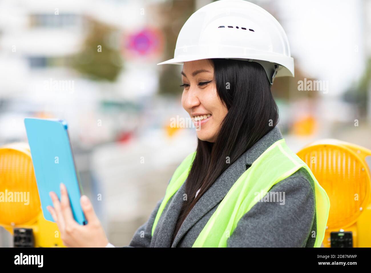 Woman safety vest helmet hi-res stock photography and images - Alamy