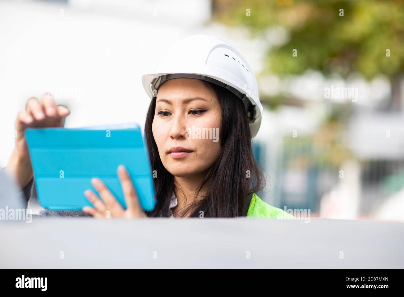 Woman safety vest helmet construction hi-res stock photography and ...