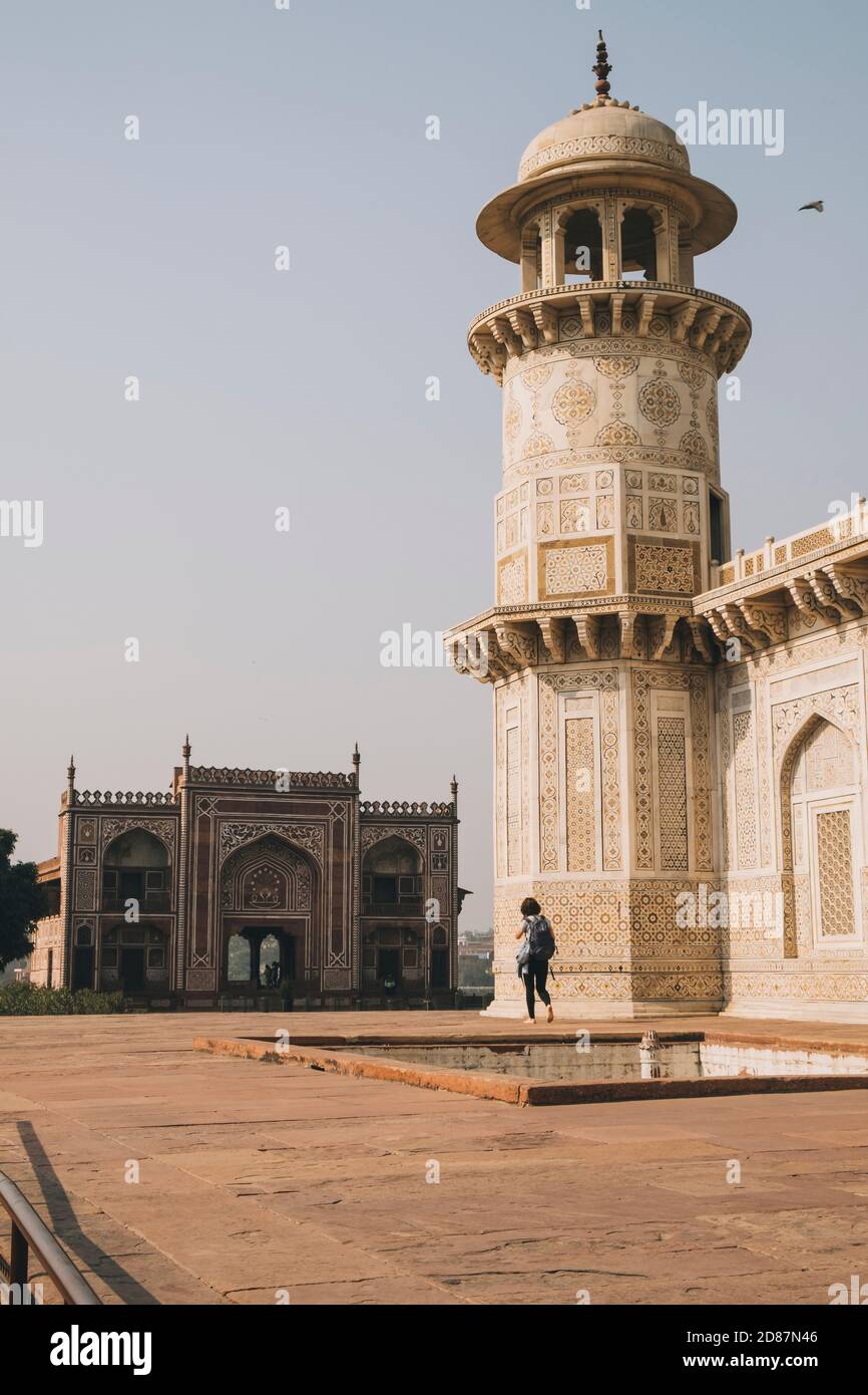 Young woman walking around the Tomb of Itmad-ud-Daula visiting in Agra, India Stock Photo