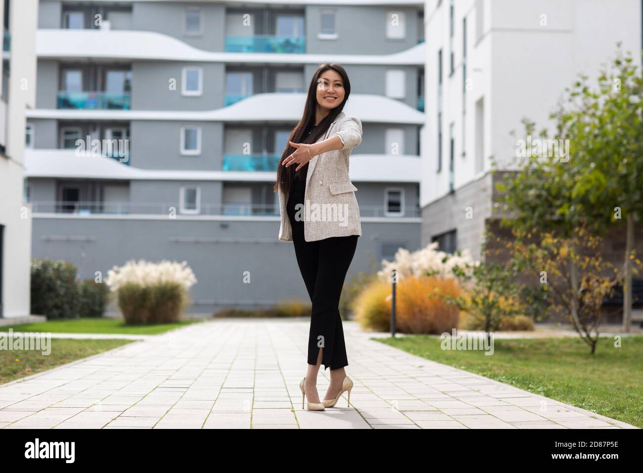 Woman with high heels  outside in front of new buildings Stock Photo