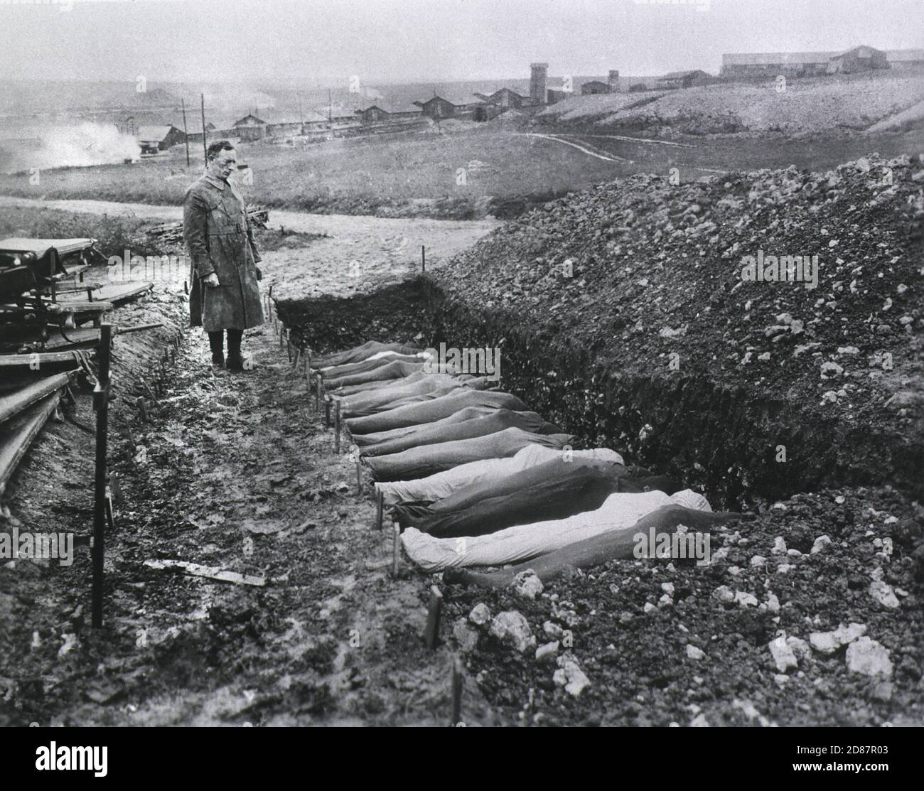 Chaplain T.R. White standing before Mass Burial Site for Soldiers that died while at Red Cross Hospital no. 114, Fleury sur Aisne, Meuse, France, 1914-1918 Stock Photo