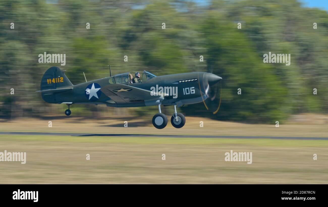 Tyabb, Victoria / Australia - March 9 2014: Curtiss P-40F Warhawk taking off at Tyabb Airport as a demonstration in the 2014 airshow Stock Photo