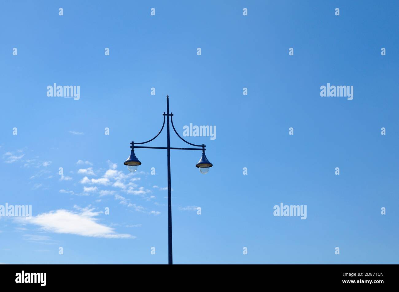 Lamp post against blue sky and clouds, Eastbourne, East Sussex, England, UK Stock Photo