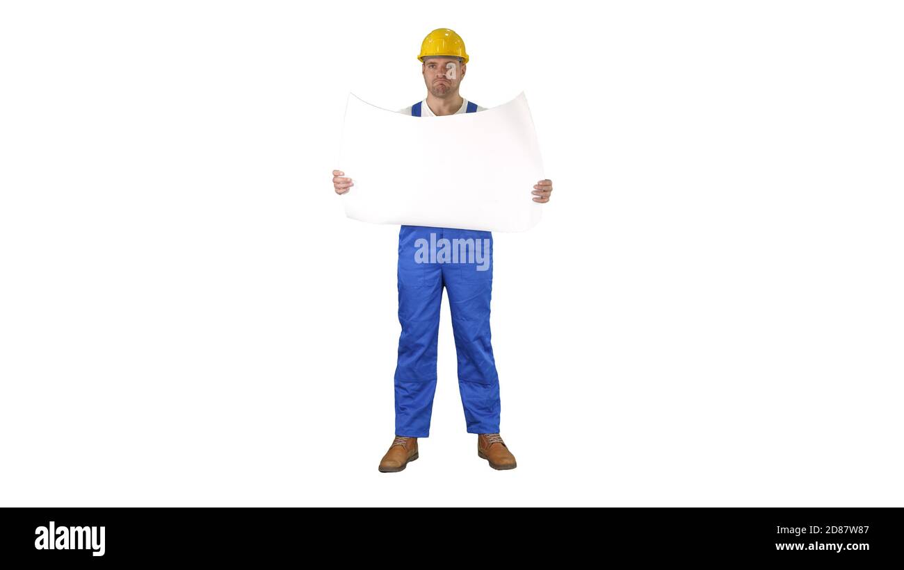 Construction worker checking blueprints on site on white background. Stock Photo