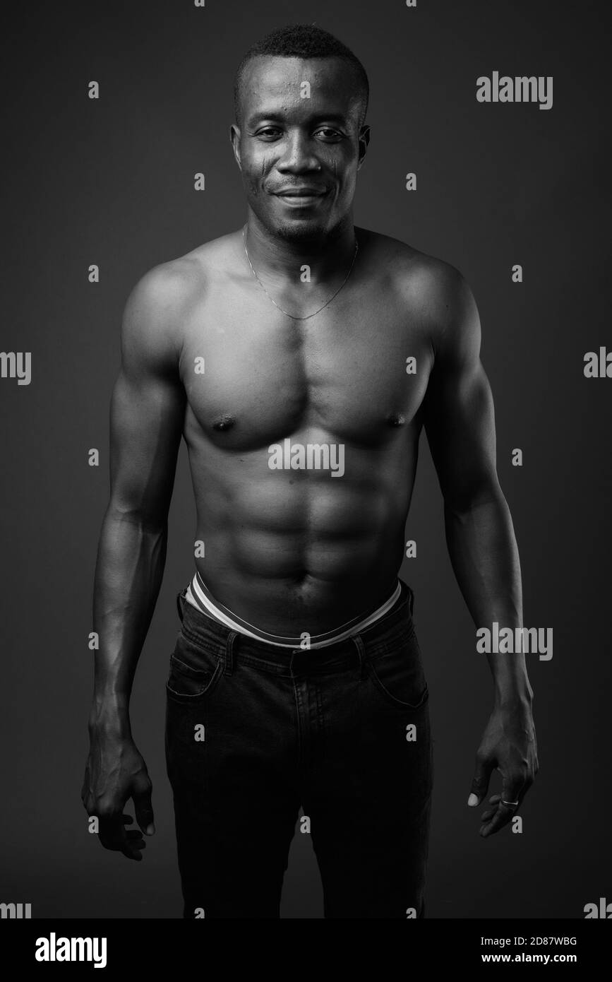 young-shirtless-african-man-against-gray-background-stock-photo-alamy