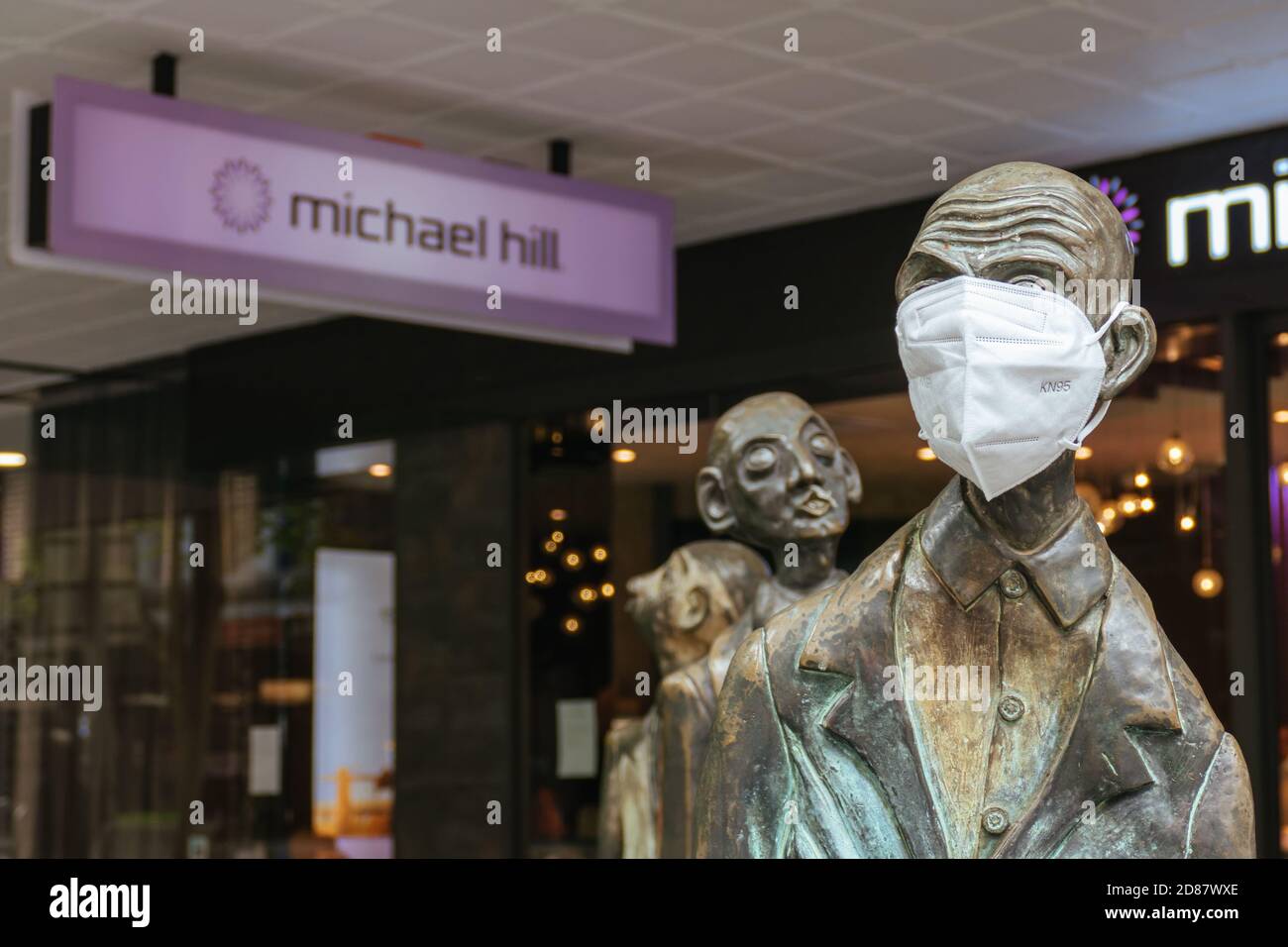 Three Businessmen Who Brought Their Own Lunch Sculptures During Coronavirus Pandemic Stock Photo