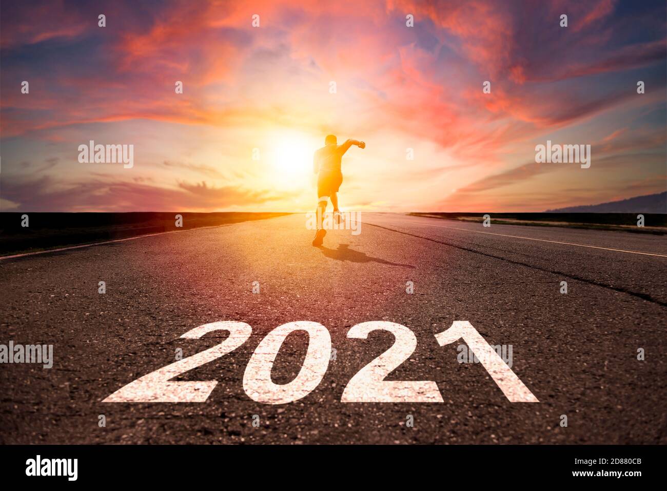 man running and sprinting on road with celebration 2021 new year concept Stock Photo